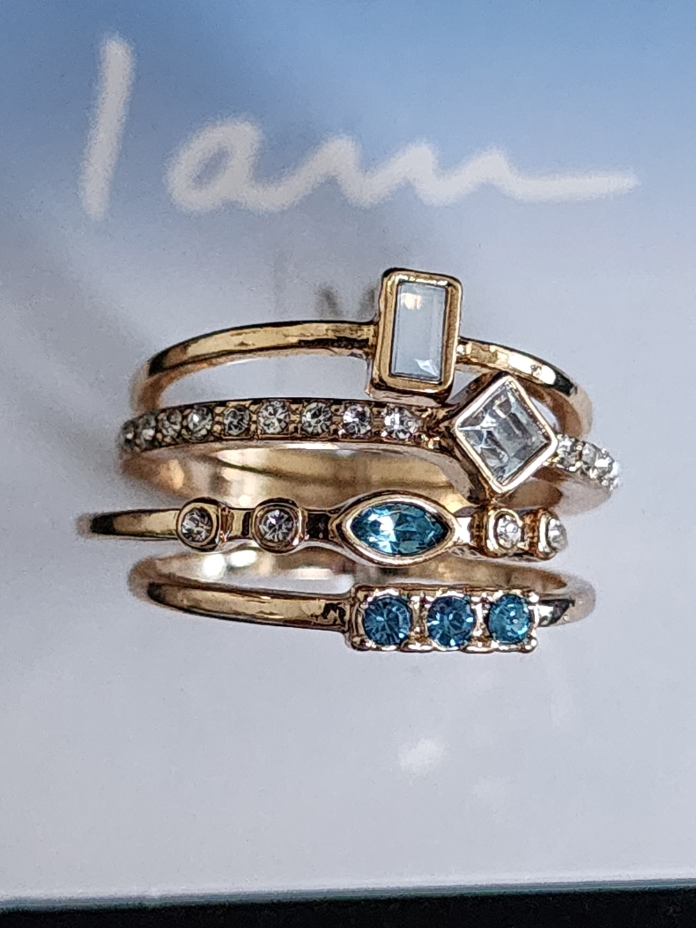 Stackable Gold Tone Ring Set with Blue and Clear Gem Accents